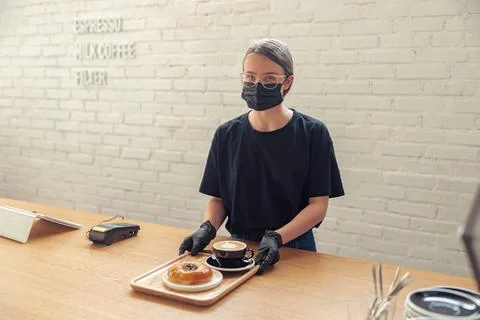 Worker in protection mask compling with quarantine measures Stock Photos