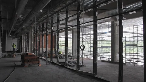 Worker with protective gear working at construction site. 스톡 동영상 99975543