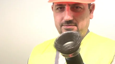 Worker in a protective helmet with a drill 動画素材 93099440