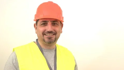 Worker in protective helmet laughs Stock Footage 93191585