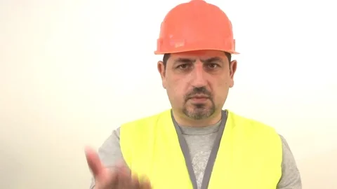 Worker in protective helmet signs stop Stock Footage 93192475