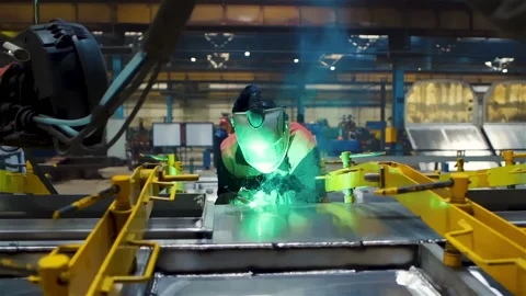 Worker In Protective Helmet Using Welding Tool To Fabricate Steel Details Stock Footage 223384196