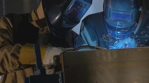 Worker with protective mask welding metal Stock Footage 64990003