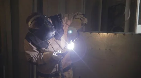 Worker with protective mask welding metal Stock Footage 65302888