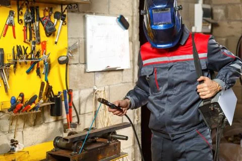 Worker with protective mask welding Stock Photos