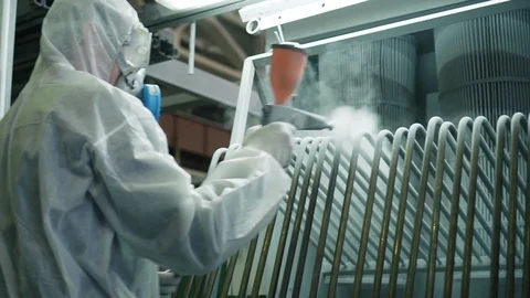 Worker in protective overalls works with hazardous chemicals, sprays it on metal Stock Footage 116233285