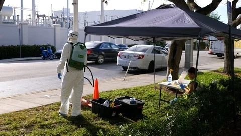 Worker in protective suit to clean bus against covid-19 coronavirus disease Stock Footage 126583494