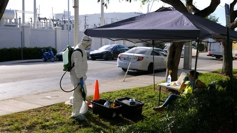 Worker in protective suit to clean bus against covid-19 coronavirus disease Stock Footage 126583549