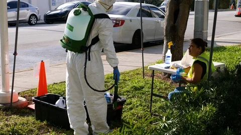 Worker in protective suit to clean bus against covid-19 coronavirus disease Stock Footage 126584196