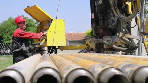 Worker in Protective Workwear Operates the Drilling Rig Machine Stock Footage 311400409