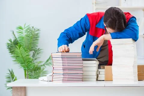 Worker in publishing house preparing book order Stock Photos