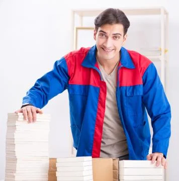 Worker in publishing house preparing book order Stock Photos
