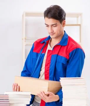 Worker in publishing house preparing book order Stock Photos