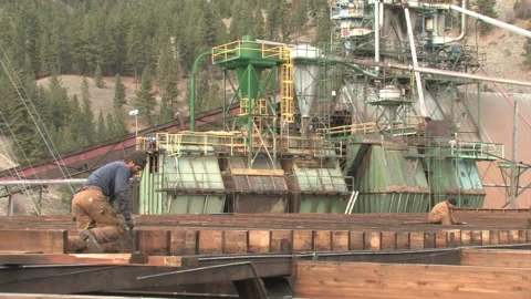 Worker Pulling Boards from Roof at Deconstruction Site in Bonner Stock Footage 134199665