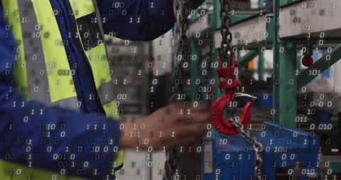 Worker pulling chain, aligning red hook, securing for plant rigging with binary Stock Footage 331026988
