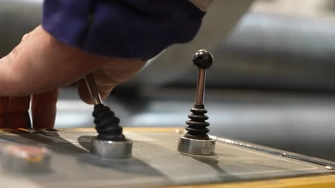 Worker pulling a industrial lever Stock Footage 256143432