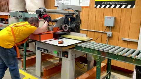 Worker Pulling Table Cutting saw machine to cut the wood inside Home Depot Stock Footage 168004556