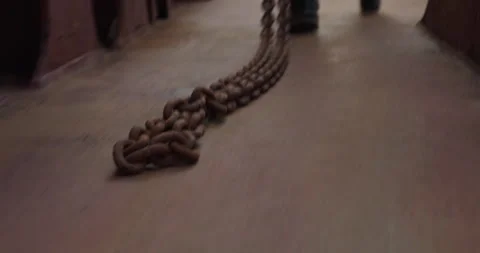 Worker pulls chain walking along cargo ship desk closeup Видео 320454158