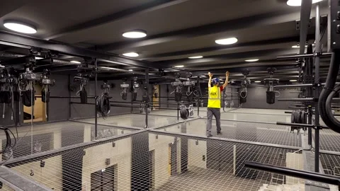 Worker Pushes Ceiling Rail With Electric Chain Hoists In Theater Stock Footage 262111500