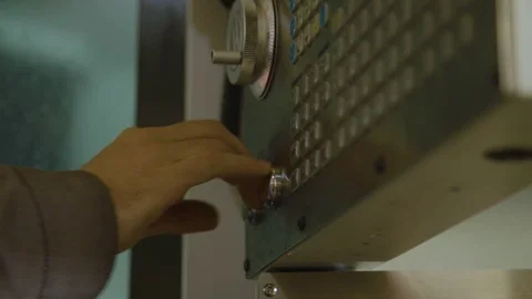 Worker pushing a button of a complex plant machinery Stock Footage 98639246
