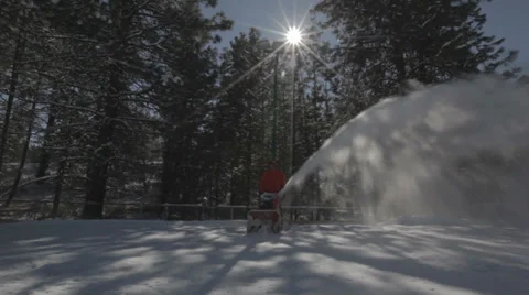 Worker pushing snow thrower after winter blizzard snowfall in residential area Video stock 35579156