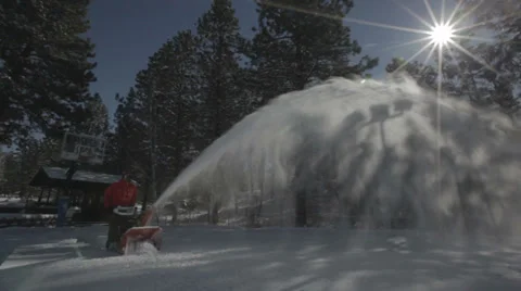 Worker pushing snow thrower after winter blizzard snowfall in residential area Video stock 35582246