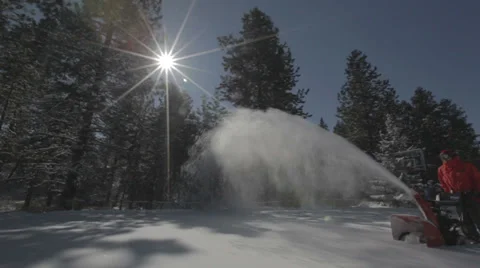 Worker pushing snow thrower after winter blizzard snowfall in residential area Video stock 35619015