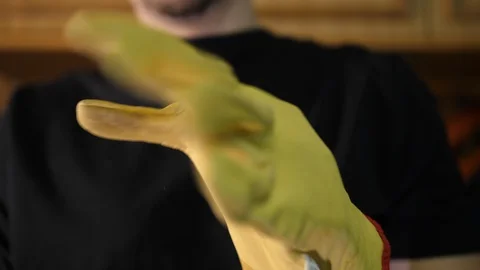 Worker put on Yellow Gloves on Hands. Diy carpenter prepares for work. Isolated. 库存影片 129462455