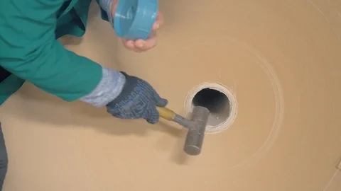 Worker puts cap to large paper roll in warehouse closeup Stock Footage 113397972