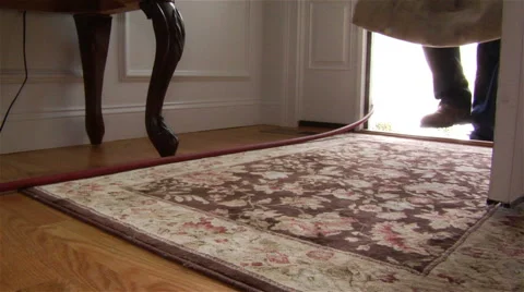 Worker puts down a drop cloth in a foyer Stock Footage 42961458