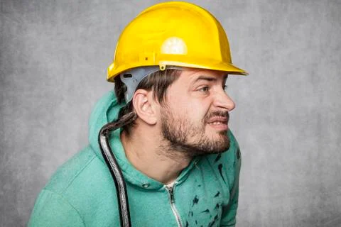 The worker puts up an ear to eavesdrop on others Stock Photos