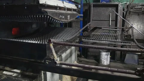 Worker puts the glass on the frame.Preparations for tempering glass in an oven. Stock-Footage 122217999