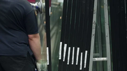 Worker puts the glazed windows. Production of packet windows Video stock 199486784