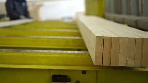 Worker puts glued processed board in hydraulic press to connect wooden Stock Footage 82284876