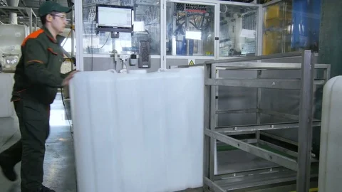 Worker Puts Intermediate Bulk Container and Checks Stock Footage 79815848