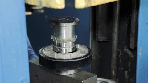 Worker puts the item under the press Stock-Footage 111247257