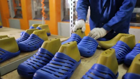 Worker puts on just made rubber slippers on the pads. Stock Footage 106859013