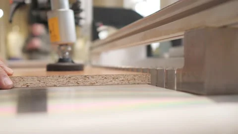 A worker puts the material on a drilling machine. Slow motion. Video stock 139061785