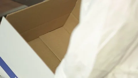 The worker puts the popsicle in a box Stock Footage 74506342