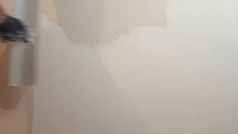 The worker puts the putty on the walls. It's equal, it's plastering Stock Footage 124226904