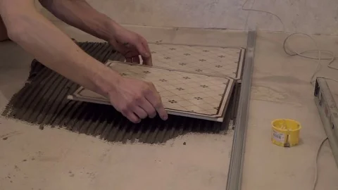 Worker puts the tile Stock Footage 74059511