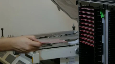 Worker puts tin on empty printed circuit board before installation by Pakito. Video stock 71247938