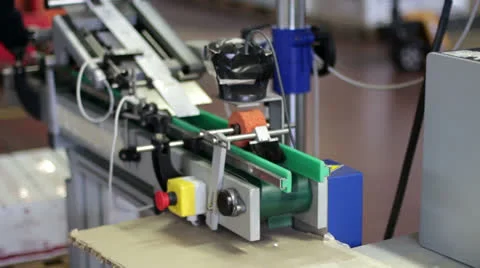 Worker puts tubes of face cream in the machine for label 스톡 동영상 22555238