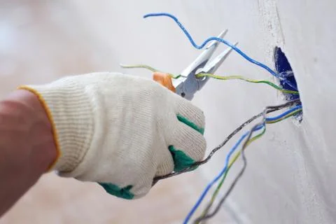 Worker puts the wires Stock Photos