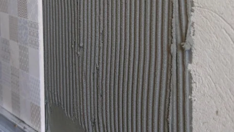 Worker Putting Ceramist Tile On The Wall Stock Footage 70355042