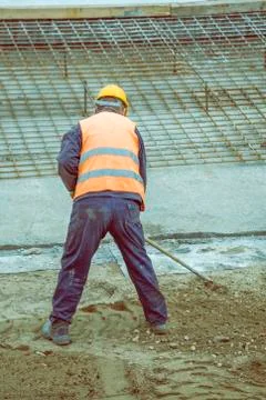 Worker with rake working Stock Photos