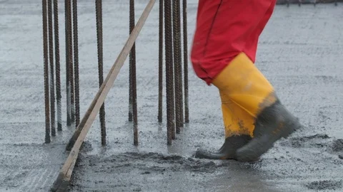 Worker raking concrete Stock Footage 102343769