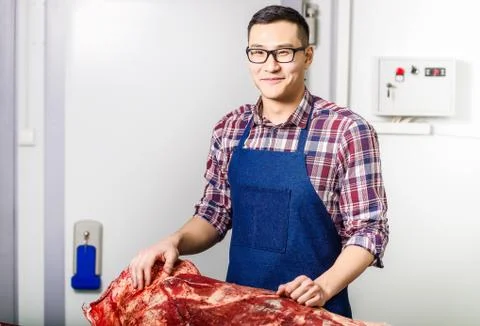 Worker with raw meat Stock Photos