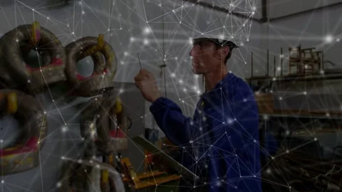 Worker reaching for shackle, doing safety check and noting clipboard, workshop Stock Footage 332523133
