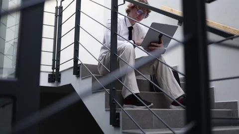 Worker reacts to mistake while using laptop Stock Footage 333975096